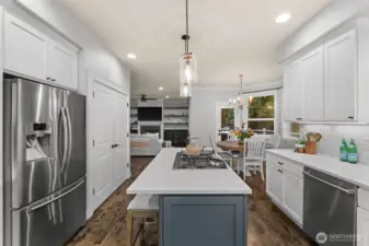 Sleek quartz counters and premium appliances throughout