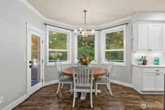 Bright nook surrounded by nature and backyard charm.