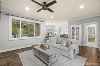 Hardwood flooring and light, airy finishes fill the home.