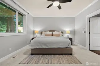 Spacious primary suite located on the main level.