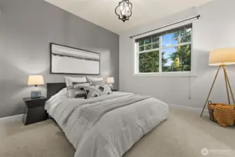 Spacious upstairs bedroom with plenty of natural light.