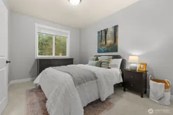 Upstairs bedroom featuring a shared Jack and Jill bathroom.