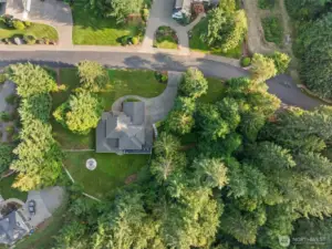 Aerial perspective highlighting home, yard, and neighborhood.