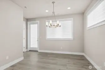 Dining room opens to the patio which overlooks the meadow.  A huge covered Trex deck spans the entire width of home.