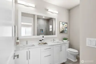 Virtual staging.  Primary bathroom with thick slab quartz countertops, double undermount sinks and a large fully tiled shower.