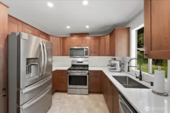 Kitchen with upgraded counters and farm type sink.