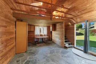 Great room has an upstairs loft and main floor cabinets.