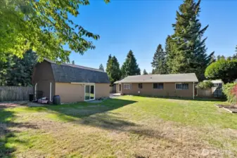 Great room is 20 ft X 15 ft. Multiple uses. Garden area to the right. Generous 11,106 Sq Ft home site.