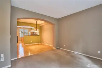 Living room, dining room and kitchen. Double arches.