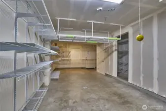 Tandem two car garage with lots of storage racks. Back door leads to back private patio.