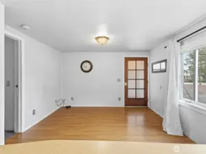 view from the kitchen to the main entrance and living area.