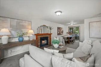 The living room seamlessly connects to the dining room and kitchen for easy every day living and entertaining with access to the deck just beyond, making it perfect for extended gatherings outdoors.