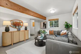 The fourth bedroom has been thoughtfully staged as a large family room, highlighting the versatility of the space and its ability to adapt to a variety of flexible living needs.