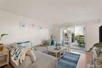 Airy living room opens on to your patio.