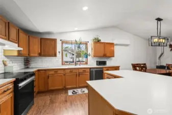 You’ll love the large kitchen! There’s so much storage and counter space. Updates since late 2023 include new hardware & lighting, a new backsplash, and a new stove and dishwasher.