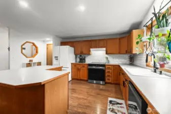 The door between the refrigerator and entry leads to the attached, 2-car garage.
