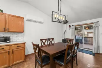 The glass slider opens to a covered annd enclosed deck with room to grill and relax.