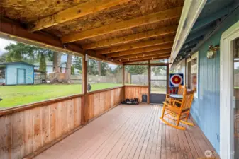 The covered, screened-in back deck offers room to grill and relax protected from the PNW drizzle and pesky summer bugs.