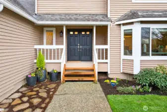 The covered front porch creates a warm arrival and a practical transition into the home year round. It adds to the home’s welcoming character while reinforcing the care and meaningful improvements found throughout the property.