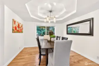 The formal dining room offers a dedicated space for gatherings, holidays, and everyday meals that deserve a more defined setting. Its position just off the main living area makes entertaining feel comfortable and well organized.