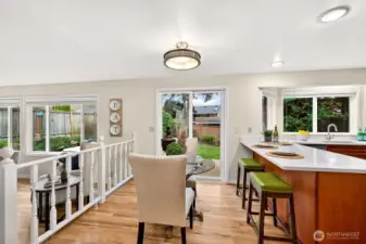 This area shows how naturally the kitchen and informal dining space connect to the outdoors through the slider. The transition to the cedar landing and backyard patio makes indoor outdoor living easy and convenient