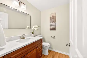 A conveniently located bath on the lower level adds flexibility for guests and day to day living. Its placement supports the home’s functional layout and adds convenience to the main living areas