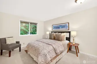 One of the secondary bedrooms offers comfortable dimensions, natural light, and flexibility for guests, hobbies, or daily use. New carpet helps give the room a clean, updated feel.