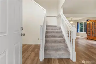 Light filled foyer with high ceilings.
