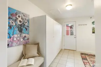 Enormous laundry room can pull double duty as a mudroom, crafting area, or storage space.