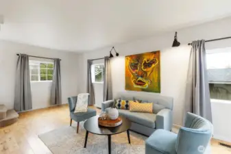 Hardwood floors, stylish lighting, tall ceilings, and lovely millwork.