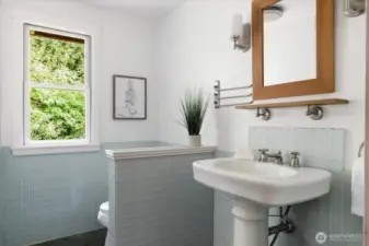 Main floor sink and toilet. Can be closed off from rest of bathroom.