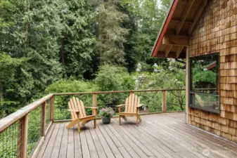 Deck wraps around to front door.