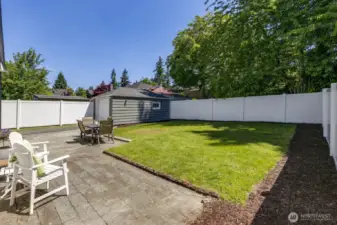This backyard soaks in the sun. Bring your gardening gloves and imagination!