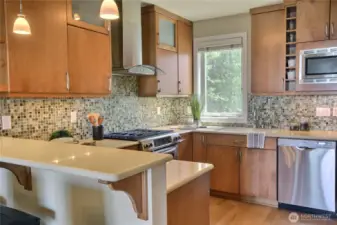 The kitchen is spacious, open with breakfast bar.