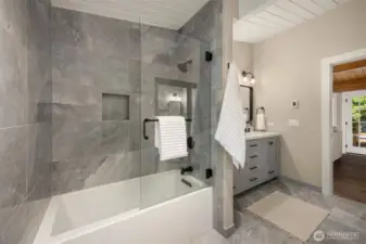 Bathroom includes tub and shower. Glass is spot free and special spot resistant treated.