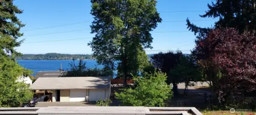 Looking at the waters of Dyes Inlet from your living room across your deck to the east.