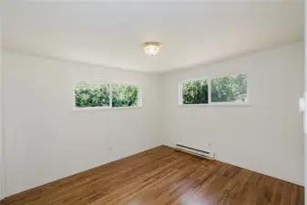 There are two possibilities for the primary bedroom.  Both have their own private bathrooms.  This one on the main floor is in the NW corner of the house with it's own bath.