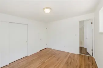 Primary looking at the open door on right going into the bath