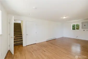 Turn around in the family room looking south again open door goes upstairs the other door goes into the garage