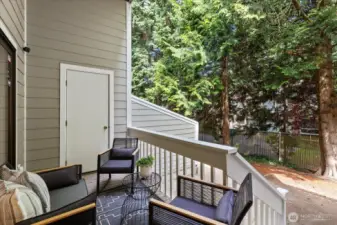 Serene deck off of living area, perfect for outdoor entertaining and relaxation.