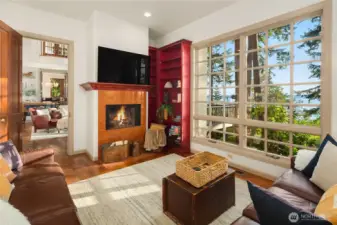 Wood burning fireplace in relaxing first level study or office.