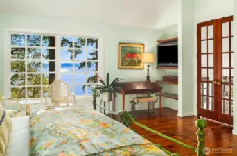 Waterfront view from bedside and seating area.