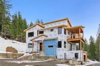 Welcome to 901 Whisper Creek Drive.  Front of the home with see through fireplace in front.