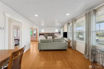 Large living room with built ins and lots of windows for natural light