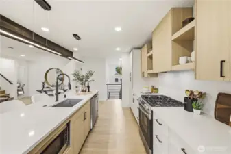 Stairs at end lof the frame lead to basement and outside.