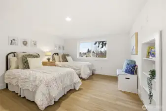 1 of 3 upstairs bedrooms. What is behind this bookcase?