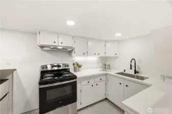 Downstairs has an oven and mini fridge for all the snacks for the big game or movie night.