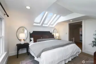 Peek Rainier and skyline views from this bedroom. Stargaze from bed or close the blinds and Zzzzzzz! King bed shown here.