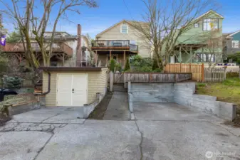 Off-street parking for two cars in the alley. Space to the right is EV-ready. Newer shed is very sturdy with power and a brand new roof. Could be a great studio or office - or even more storage!