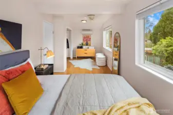 The primary suite is large enough for a king bed and a sitting room. The outlook from the bed is just gorgeous with peek a boo views of the water.